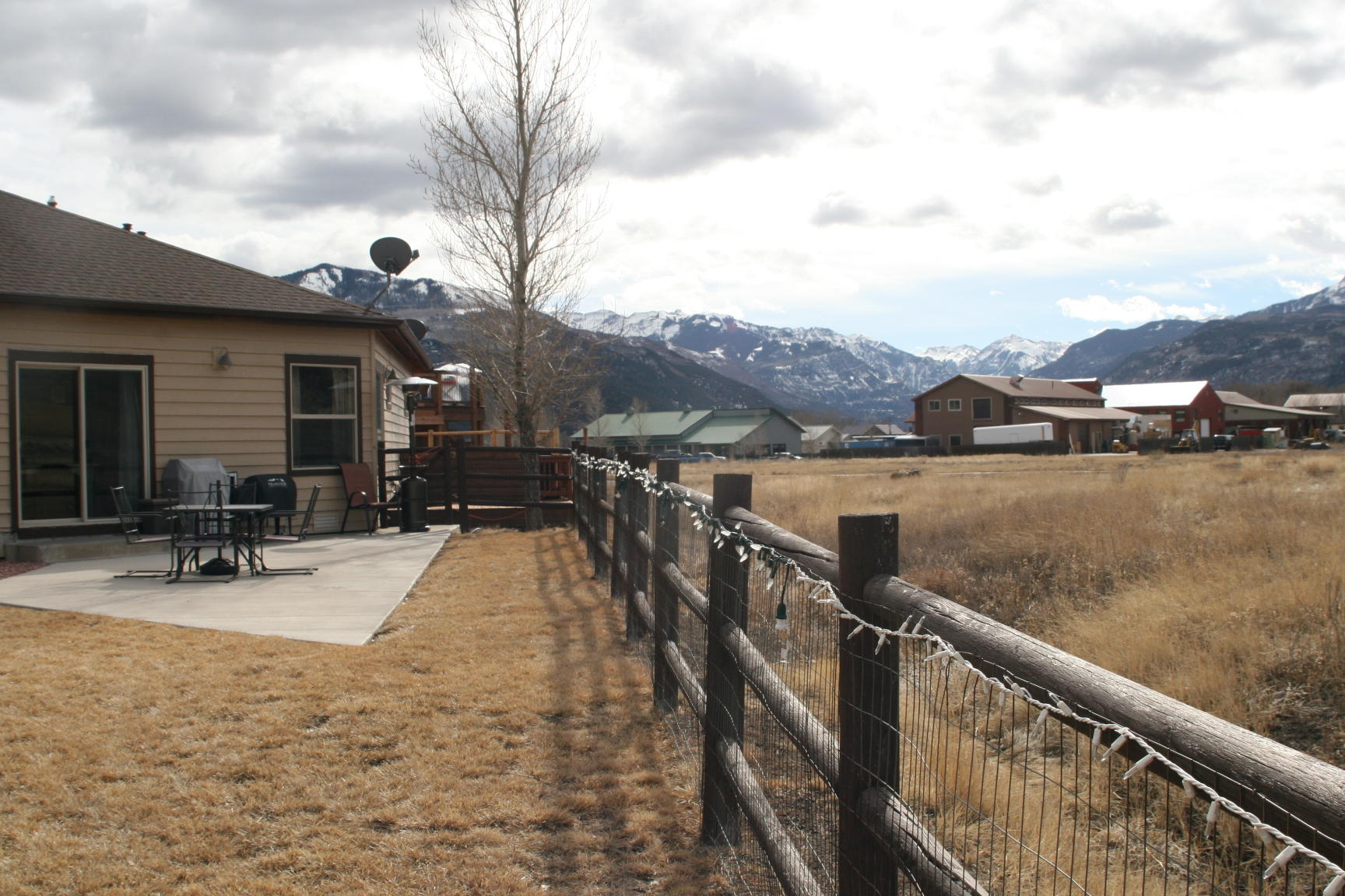 407 Kismet Street, Unit NO # Ridgway, CO 81432 - Photo 28 of 34 a view of house with outdoor seating and city view