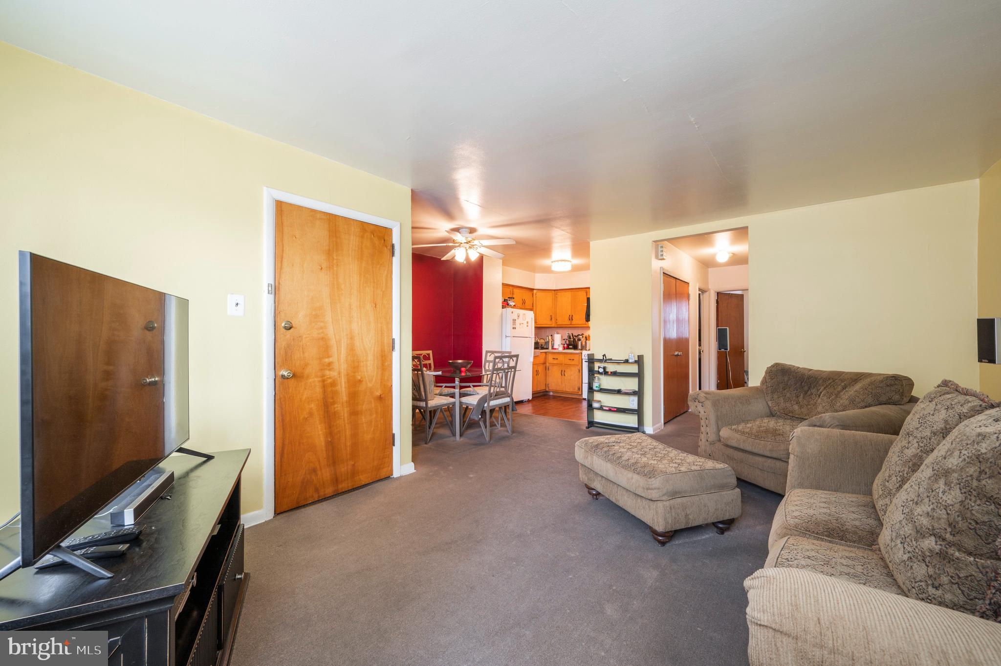2588 Cranston Road Philadelphia, PA 19131 - Photo 2 of 38 a living room with furniture and a flat screen tv