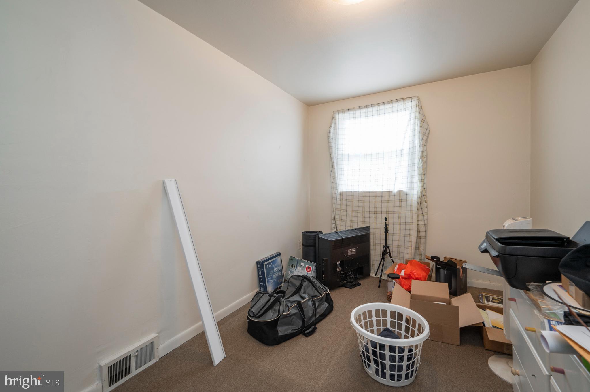 2588 Cranston Road Philadelphia, PA 19131 - Photo 12 of 38 a table and a chair in a room
