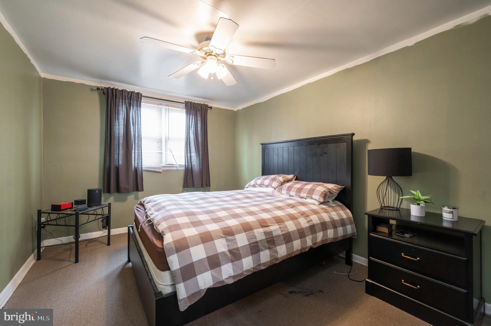 2588 Cranston Road Philadelphia, PA 19131 - Photo 13 of 38 a bedroom with a bed and a chandelier