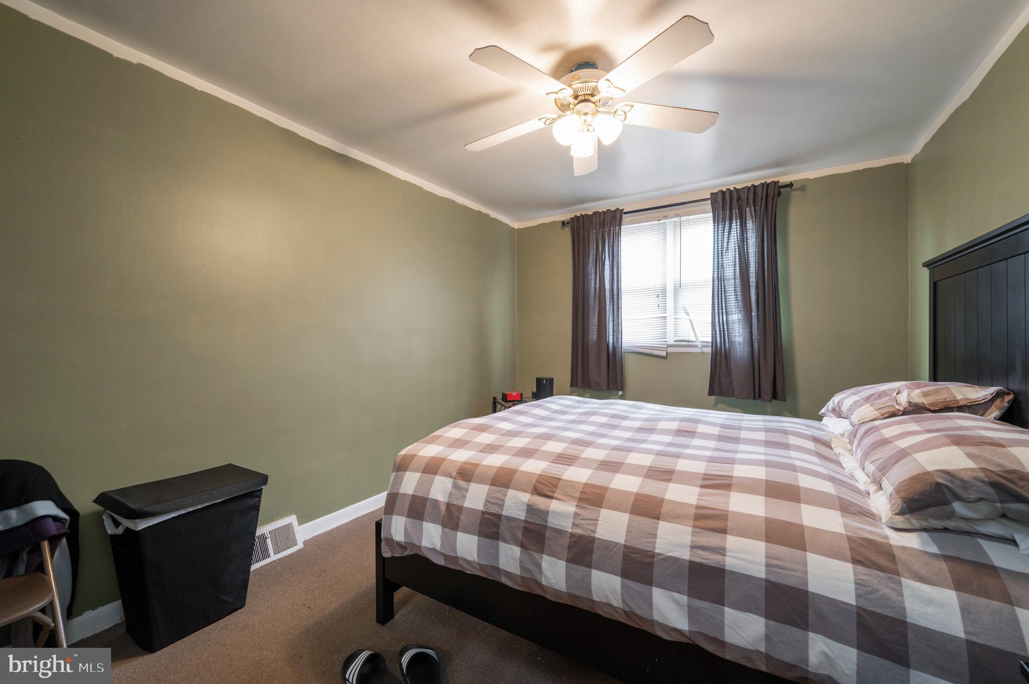 2588 Cranston Road Philadelphia, PA 19131 - Photo 14 of 38 a bedroom with a bed dresser and a window