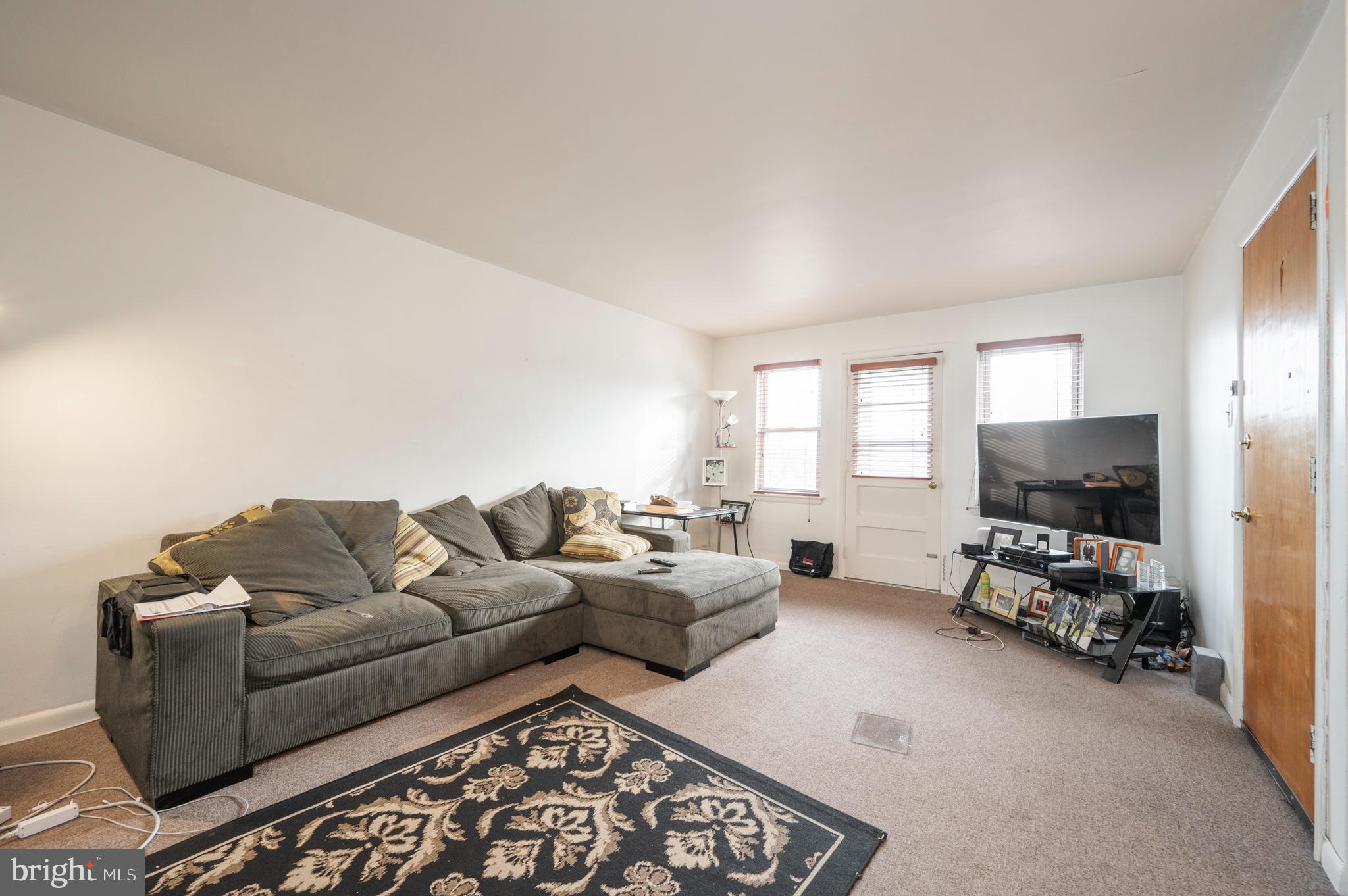 2588 Cranston Road Philadelphia, PA 19131 - Photo 18 of 38 a living room with furniture and a flat screen tv