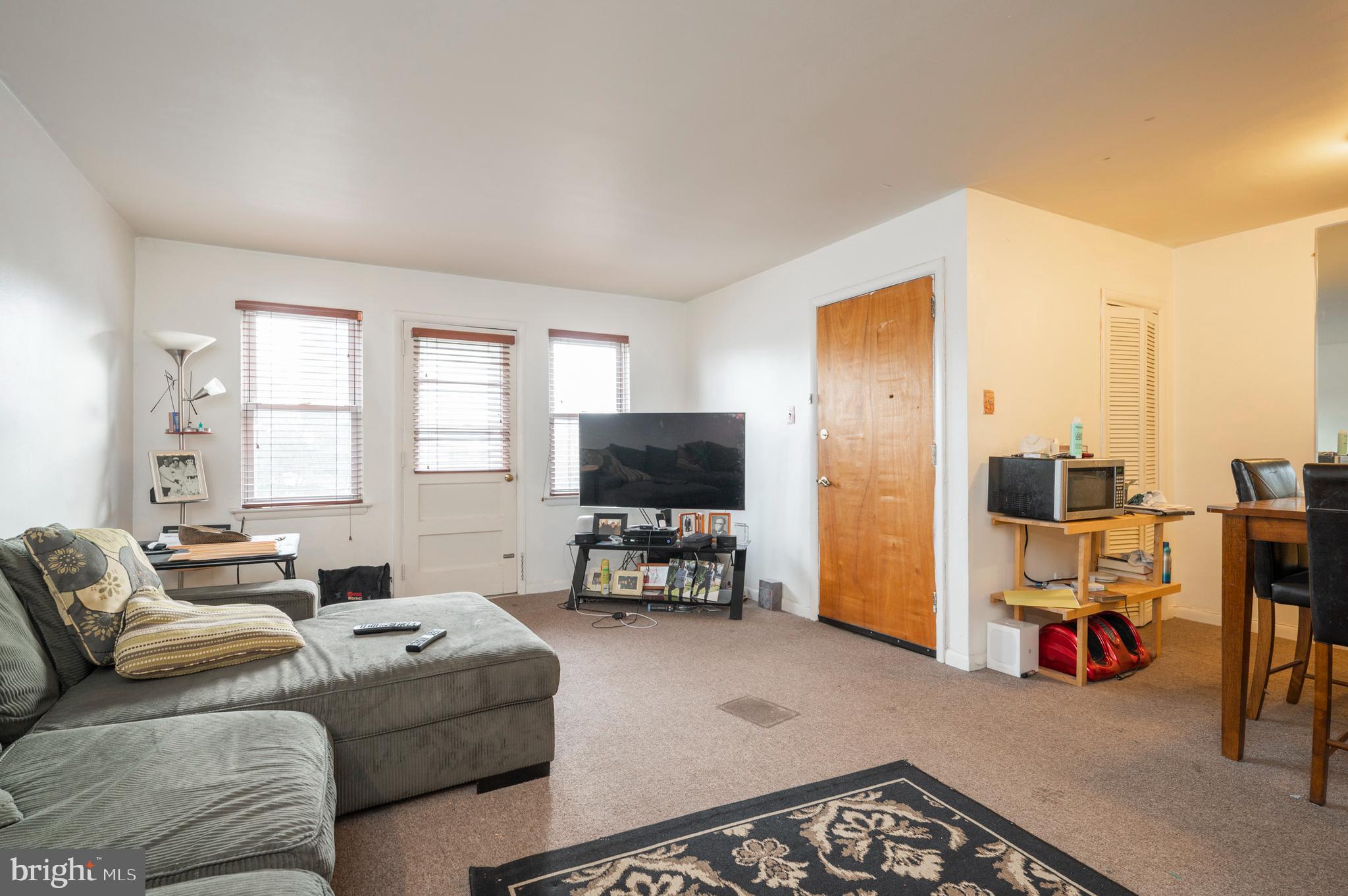 2588 Cranston Road Philadelphia, PA 19131 - Photo 19 of 38 a living room with furniture and a flat screen tv