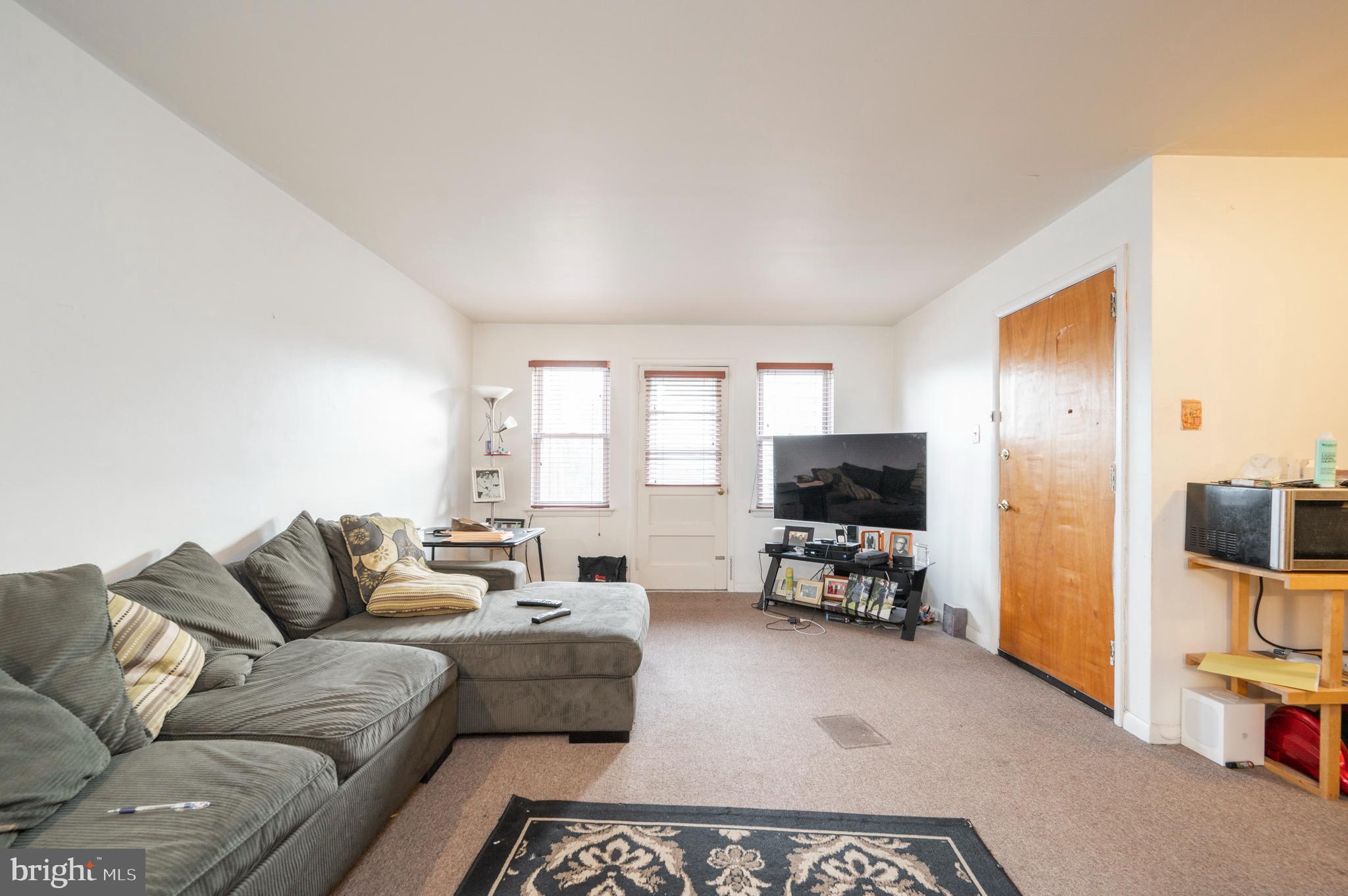 2588 Cranston Road Philadelphia, PA 19131 - Photo 20 of 38 a living room with furniture and a flat screen tv