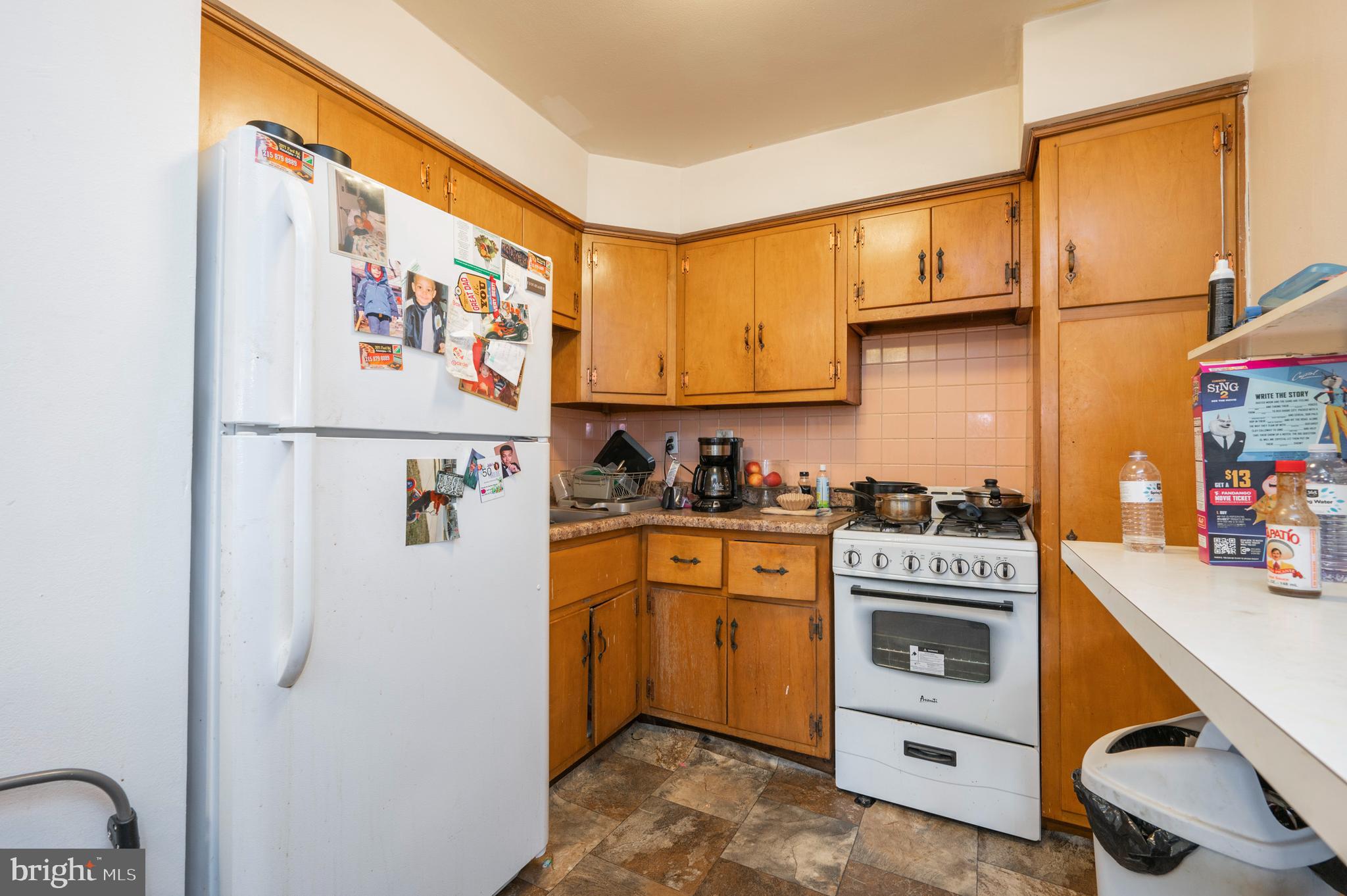 2588 Cranston Road Philadelphia, PA 19131 - Photo 22 of 38 a kitchen with stainless steel appliances a stove and a refrigerator