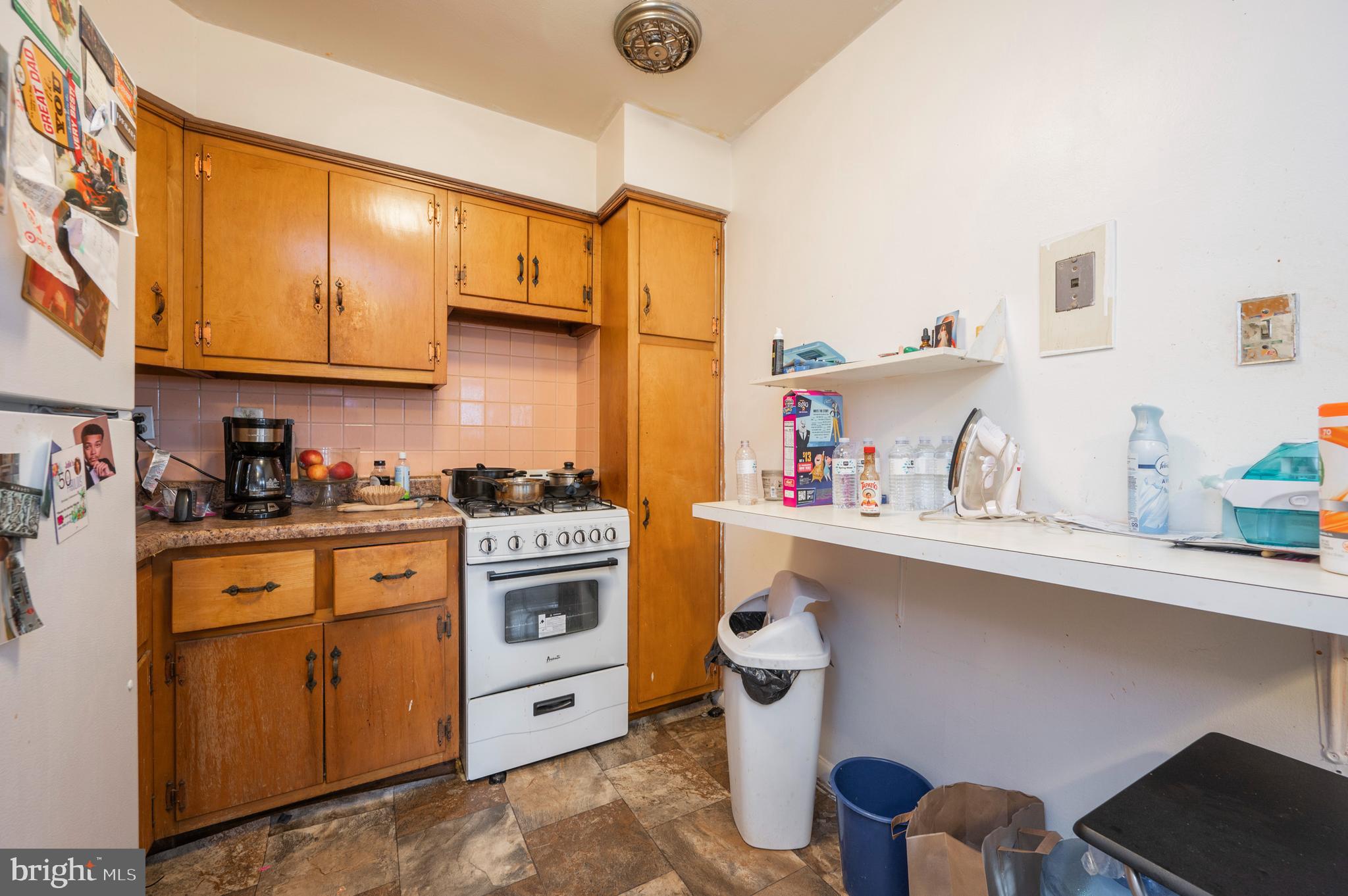 2588 Cranston Road Philadelphia, PA 19131 - Photo 24 of 38 a kitchen with stainless steel appliances a stove a sink and a refrigerator