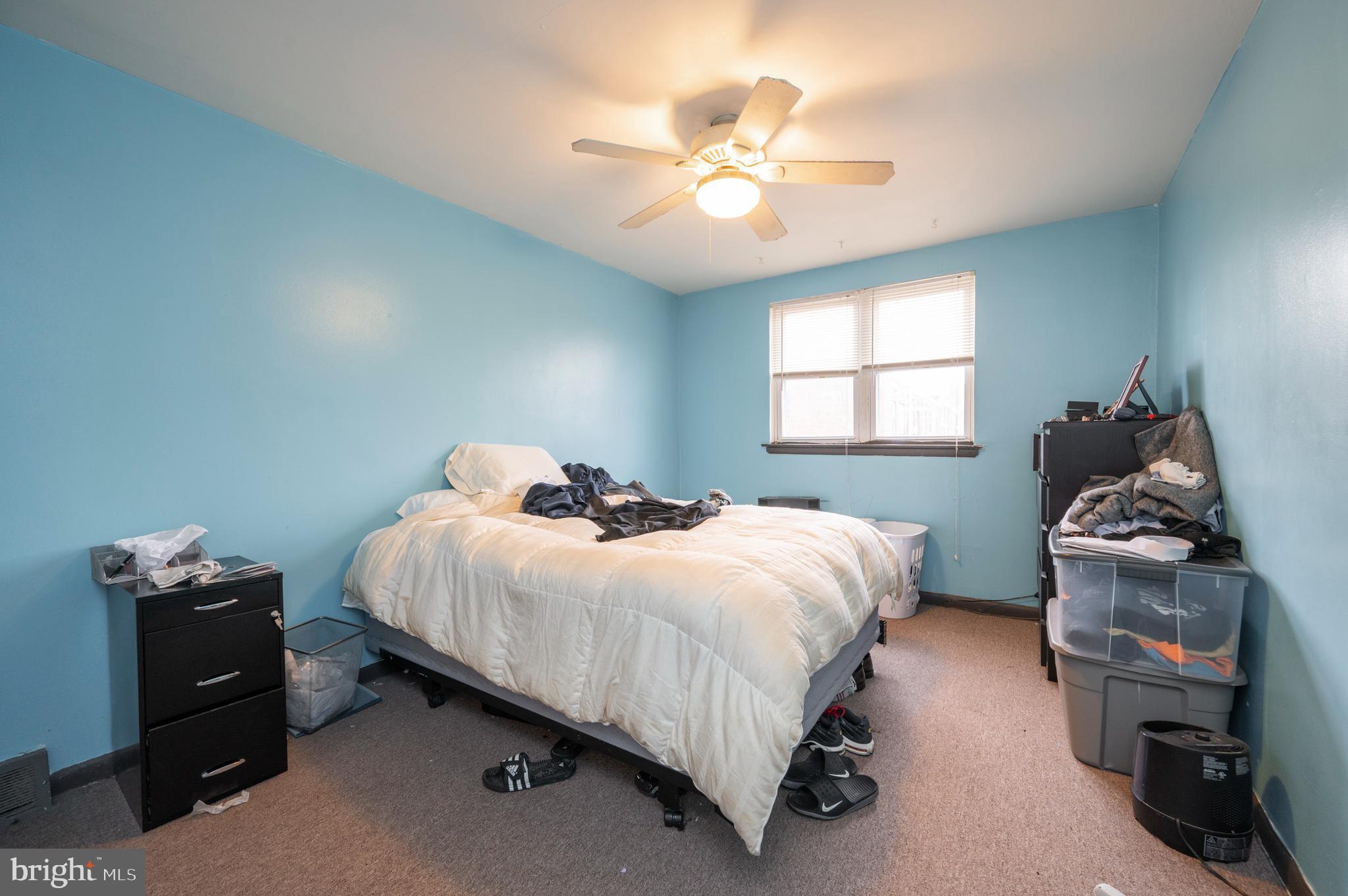 2588 Cranston Road Philadelphia, PA 19131 - Photo 29 of 38 a bedroom with a bed and a chandelier