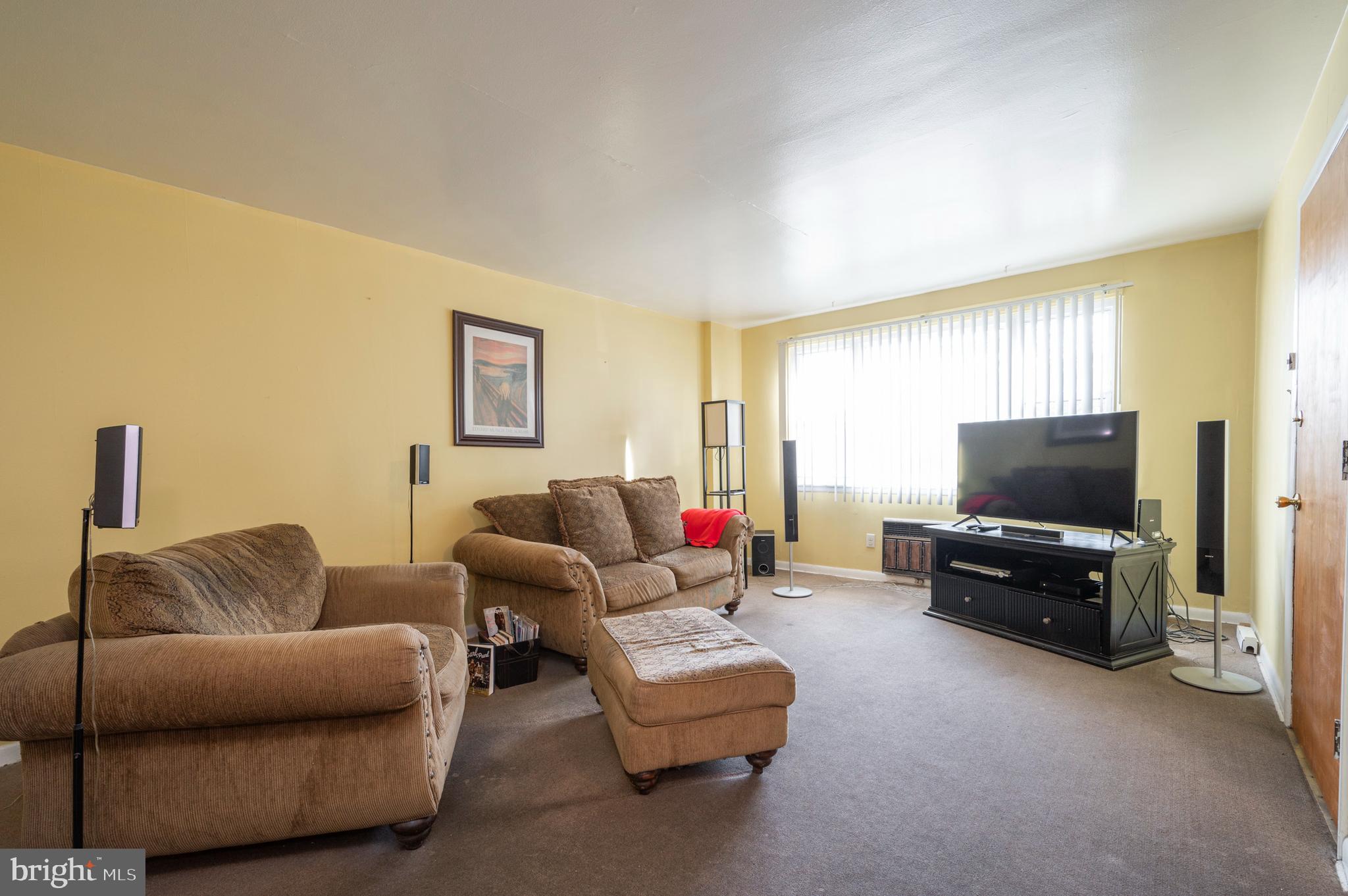 2588 Cranston Road Philadelphia, PA 19131 - Photo 4 of 38 a living room with furniture and a flat screen tv