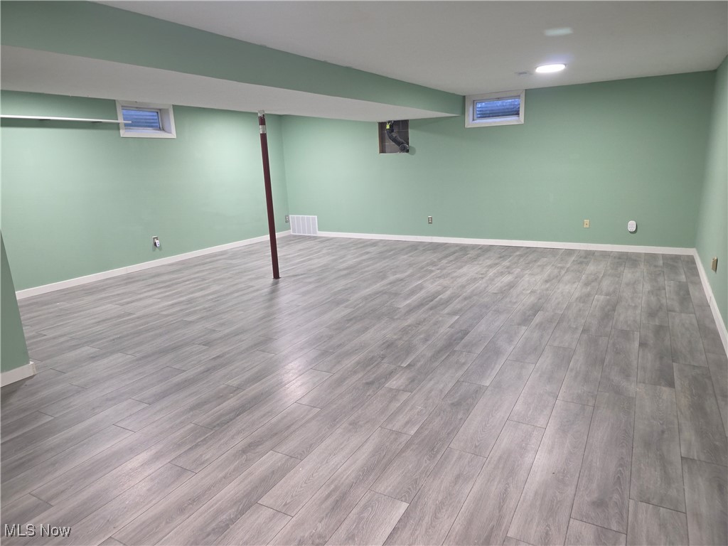 2291 Armstrong Road Wooster, OH 44691 - Photo 15 of 23 Finished below grade area featuring baseboards and wood vinyl floors