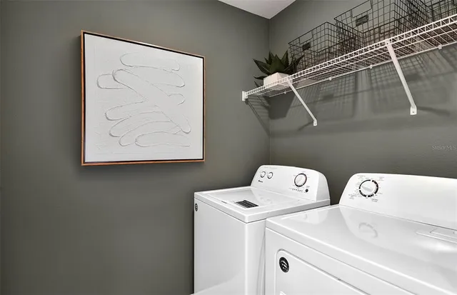 a utility room with dryer and washer