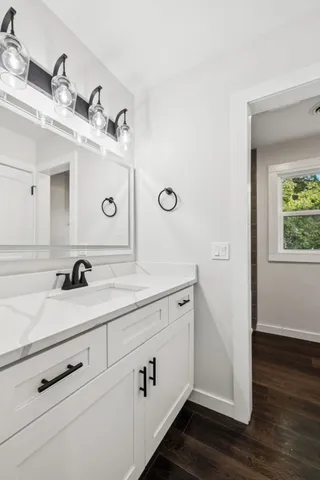 a bathroom with a sink and a mirror