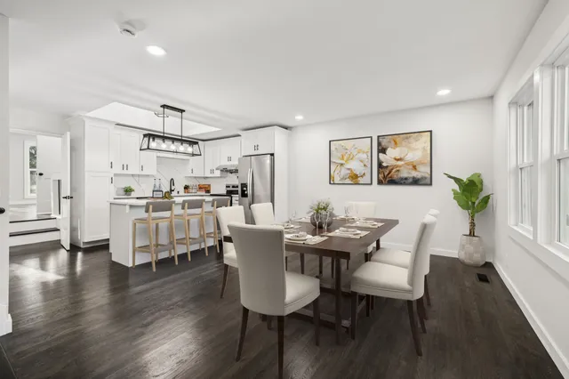 a view of a dining room with furniture and wooden floor