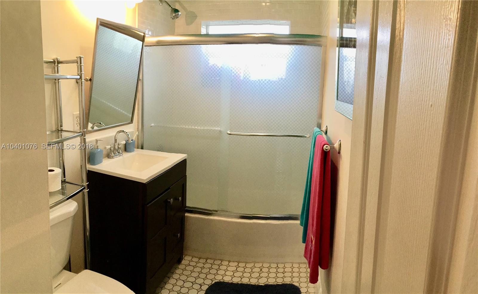 20010 Island Road Cutler Bay, FL 33189 - Photo 18 of 24 a bathroom with a sink and mirror