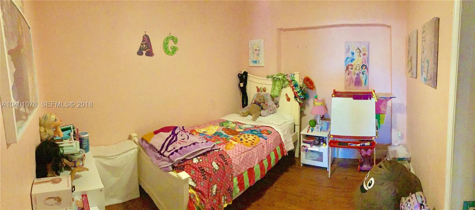 20010 Island Road Cutler Bay, FL 33189 - Photo 19 of 24 a bedroom with a bed and a painting on the wall
