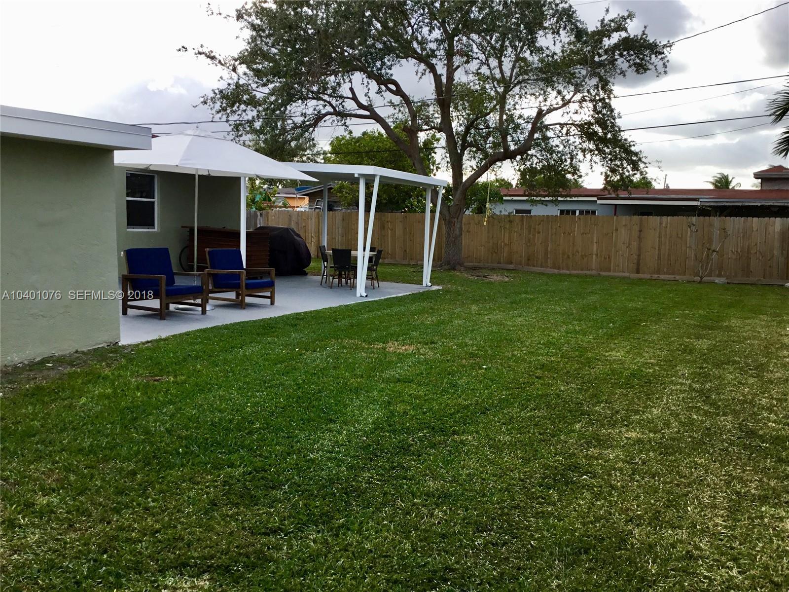 20010 Island Road Cutler Bay, FL 33189 - Photo 21 of 24 a view of a house with a yard and sitting area