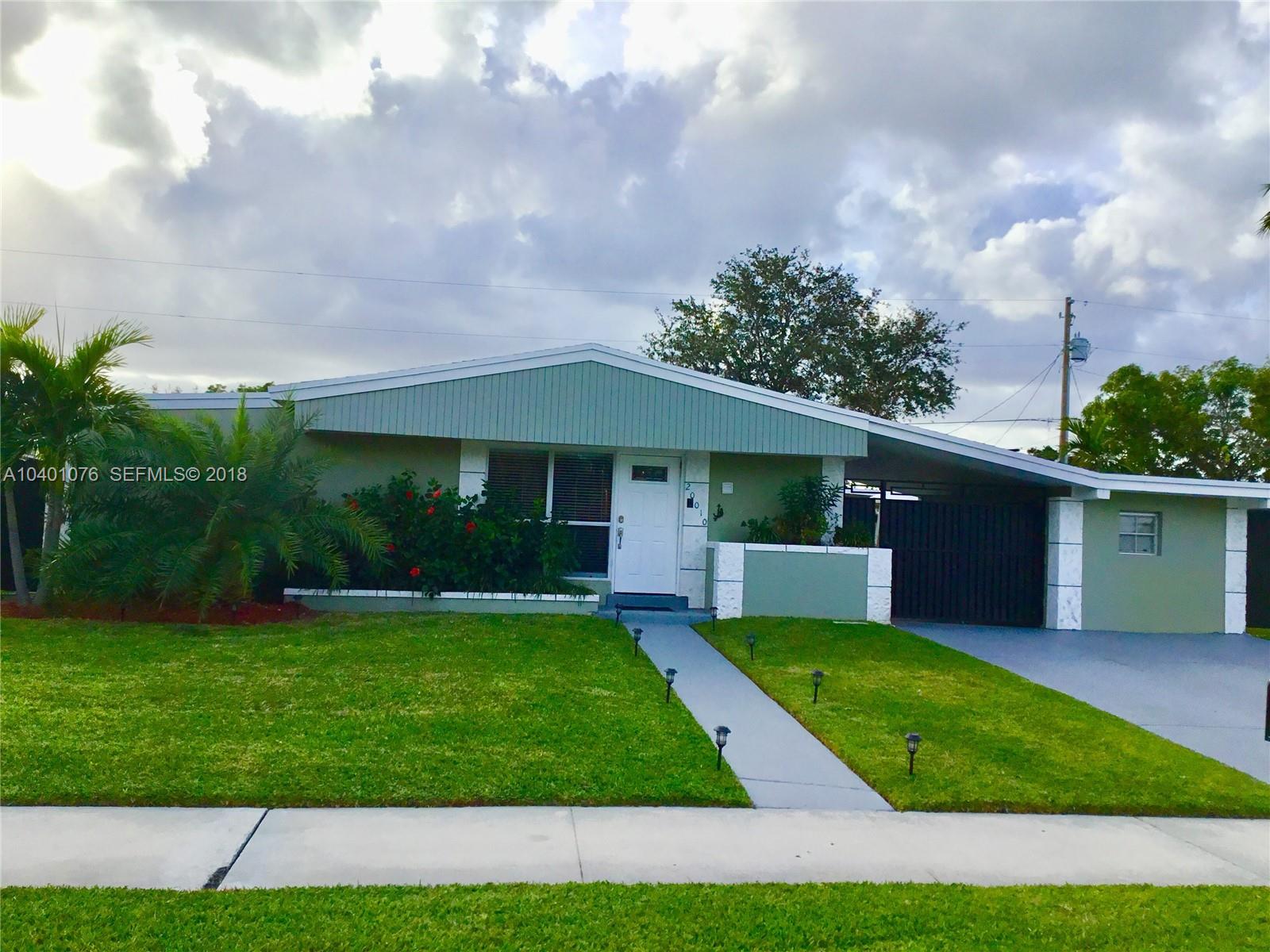 20010 Island Road Cutler Bay, FL 33189 - Photo 3 of 24 a view of a yard in front of a house