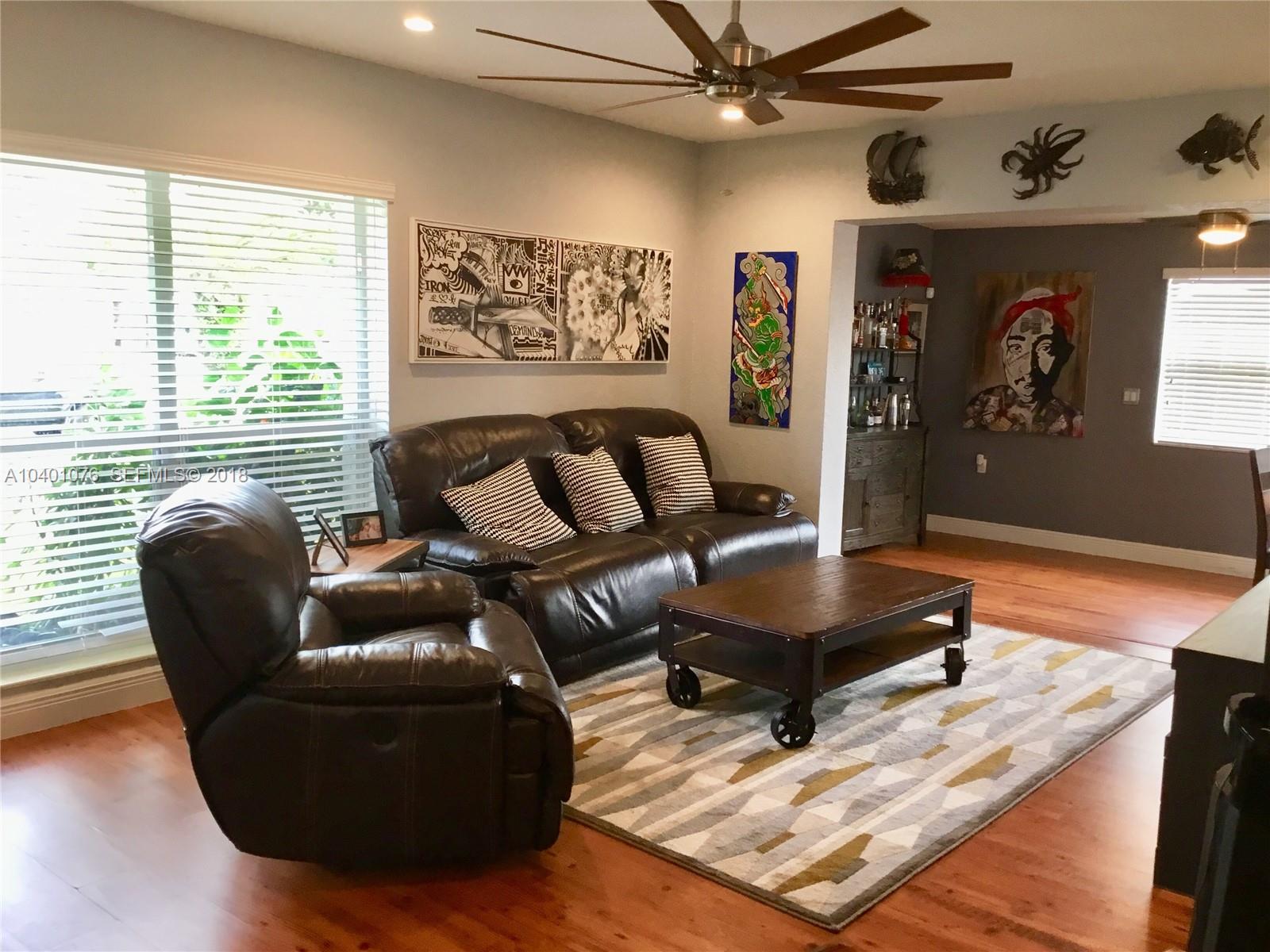 20010 Island Road Cutler Bay, FL 33189 - Photo 10 of 24 a living room with furniture and a large window