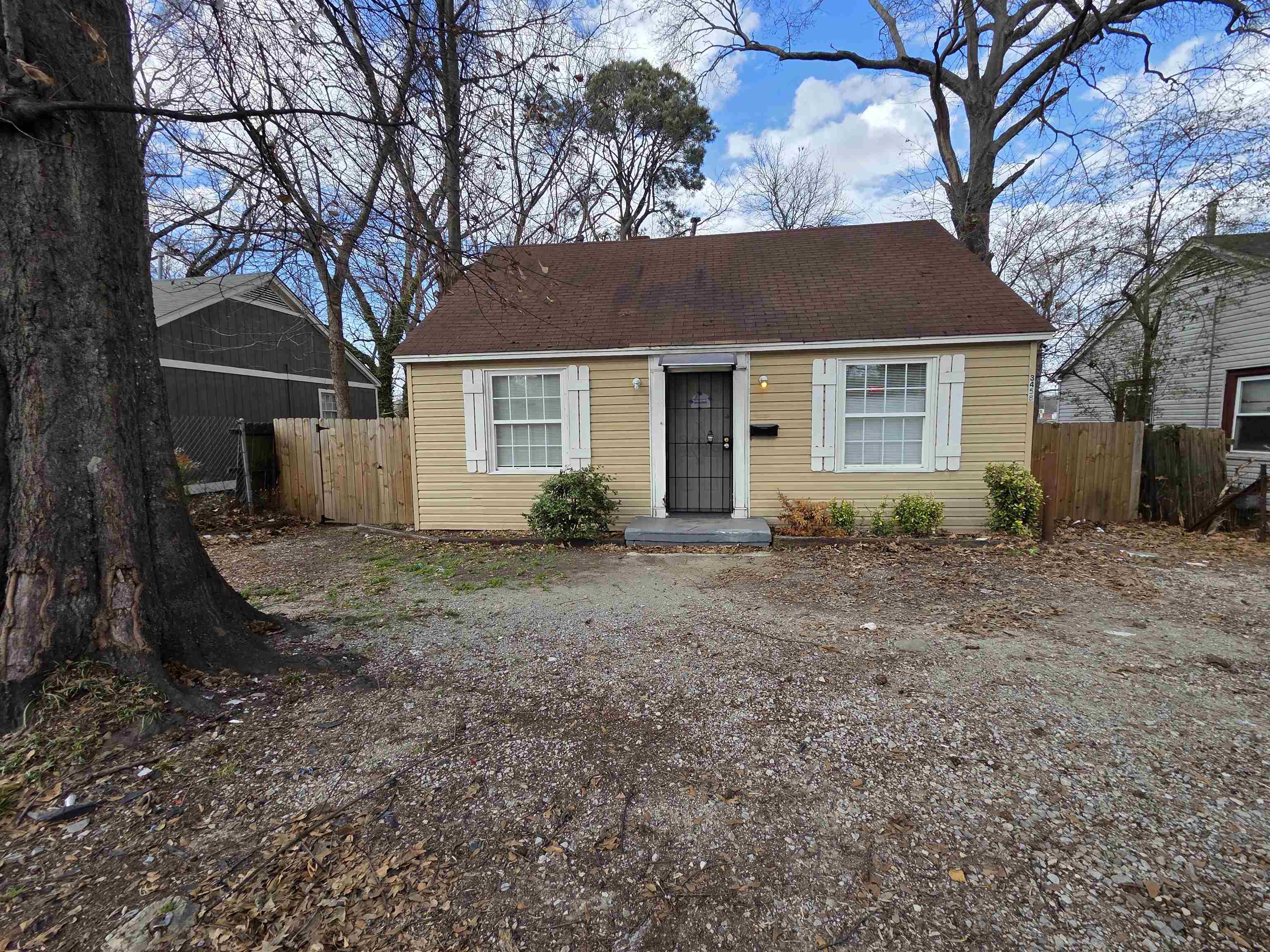 front view of a house with a yard