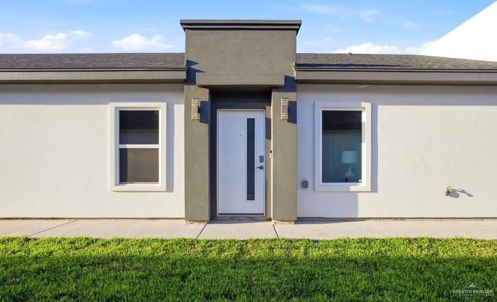 1604 Clinton Street, Unit 1 Harlingen, TX 78550 - Photo 14 of 14 Contemporary facade featuring a prominent dark gray architectural accent