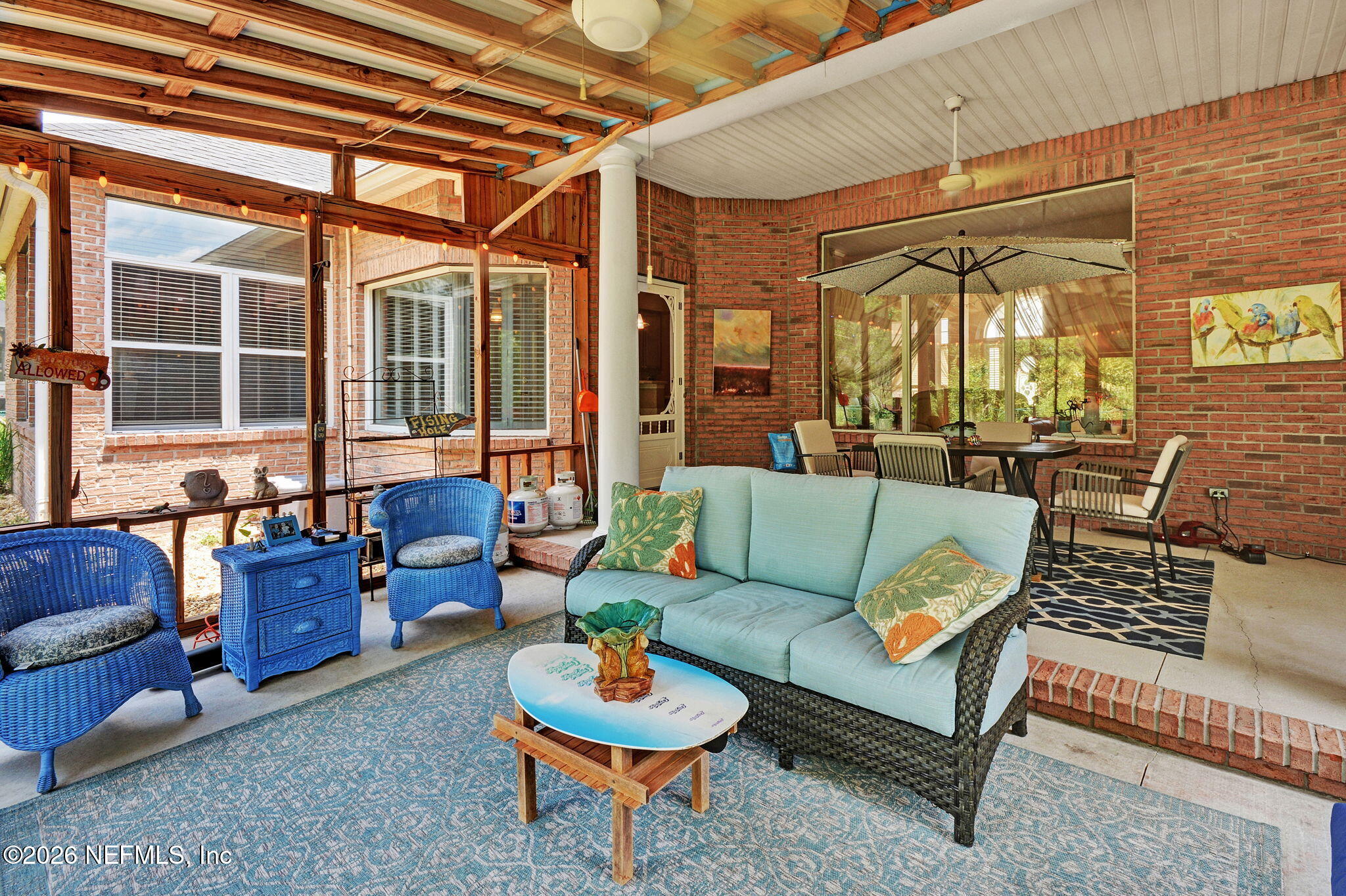 5950 West Shores Road Orange Park, FL 32003 - Photo 37 of 42 a outdoor living space with furniture and a potted plant