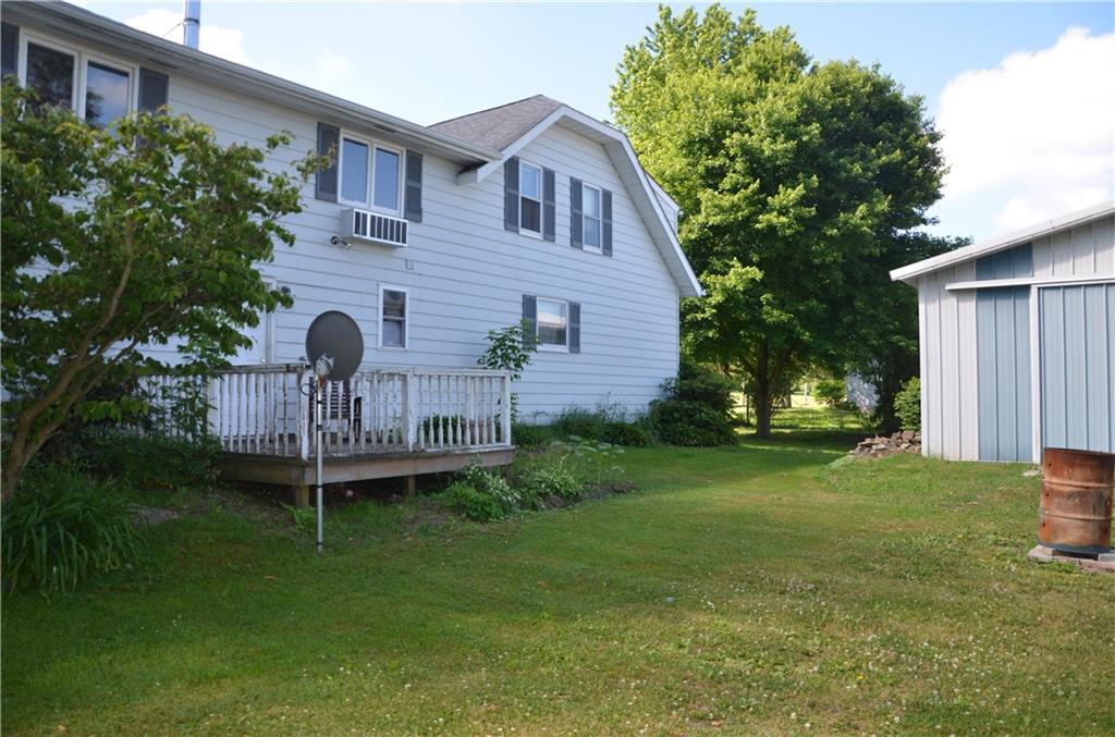 REAR VIEW OF HOME. NICE QUIET BACK DECK.