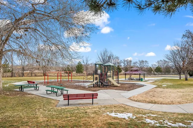 a swimming pool with outdoor seating and yard
