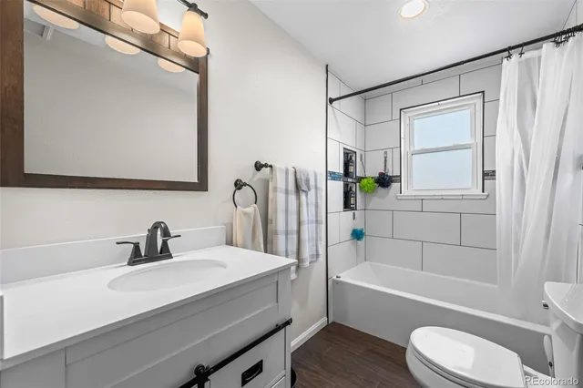 a bathroom with a sink a toilet and a bathtub