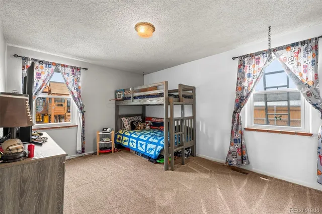 a view of a room with toys and a window