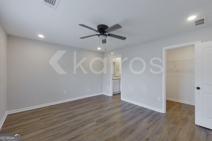 122 Cottage Grove Road Brunswick, GA 31525 - Photo 14 of 20 wooden floor in an empty room with a window
