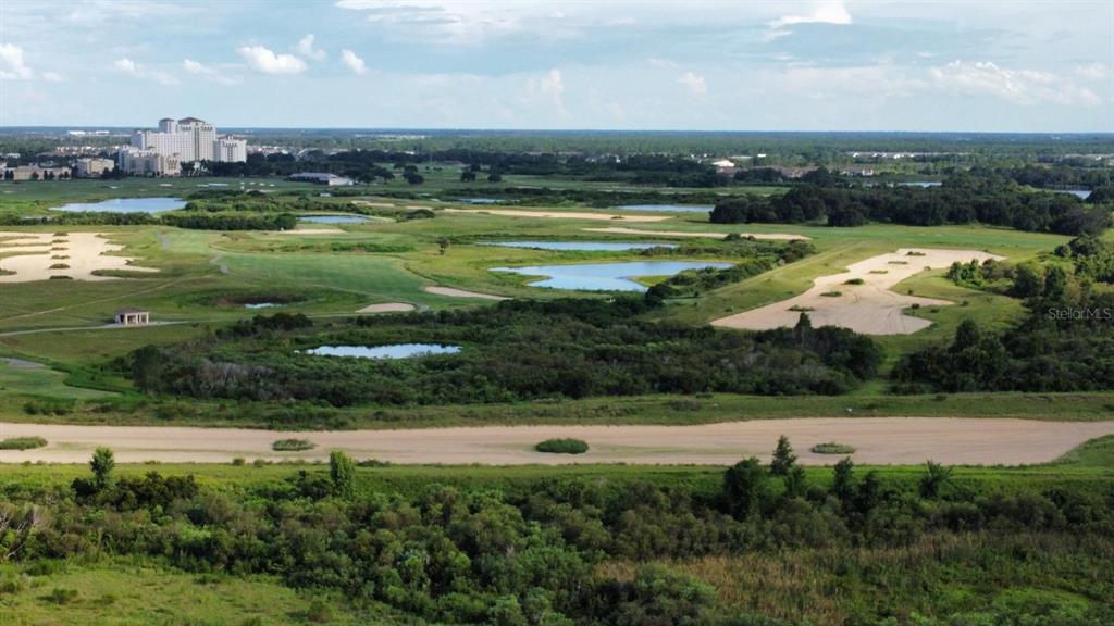 1146 Trappers Trail Loop Davenport, FL 33896 - Photo 27 of 31 a view of a swimming pool and a yard