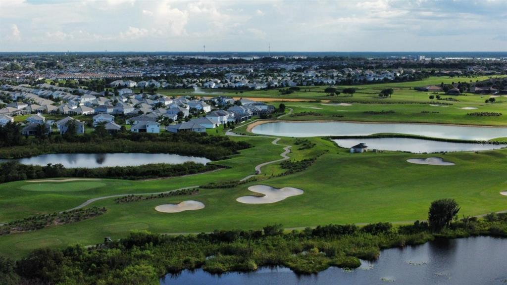 1146 Trappers Trail Loop Davenport, FL 33896 - Photo 31 of 31 an aerial view of a golf course with a lake view