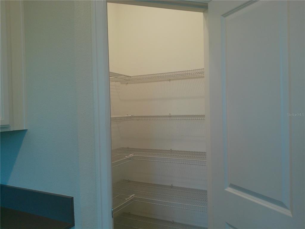 1146 Trappers Trail Loop Davenport, FL 33896 - Photo 6 of 31 a view of walk in closet