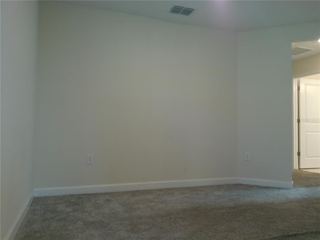 1146 Trappers Trail Loop Davenport, FL 33896 - Photo 10 of 31 a room that has a window in it