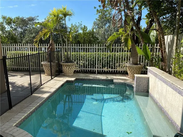 a view of a balcony with a iron fence