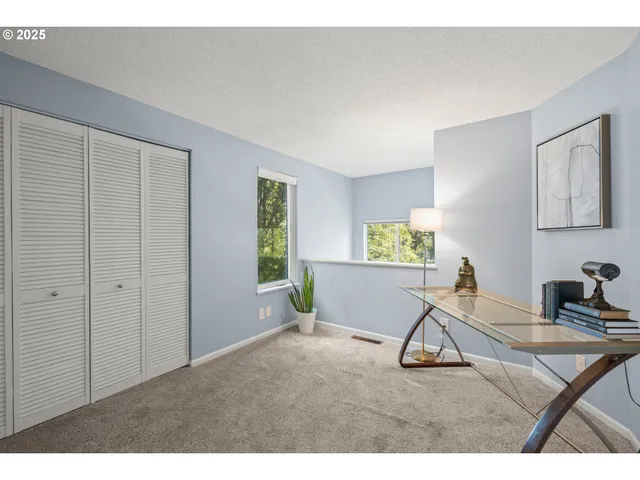 a view of a livingroom with furniture and windows
