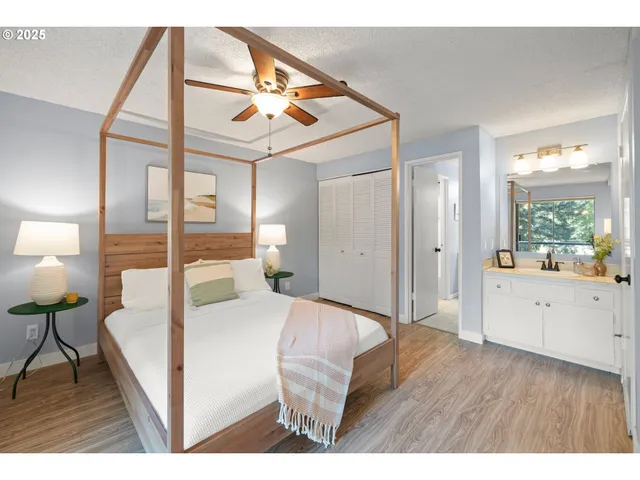 a bedroom with a bed and a large window