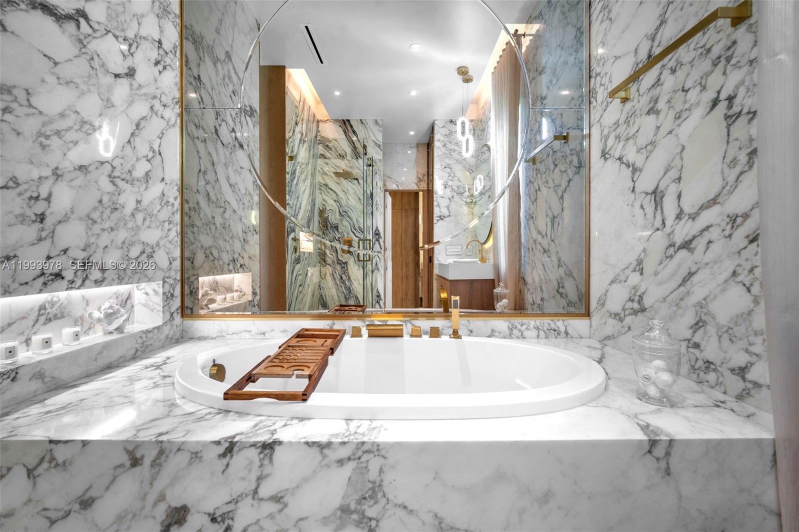 46 Northeast 162nd Street Miami, FL 33162 - Photo 23 of 44 a bathroom with a sink and a bathtub