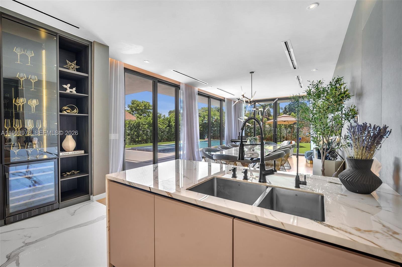 46 Northeast 162nd Street Miami, FL 33162 - Photo 33 of 44 a kitchen with a sink and large window