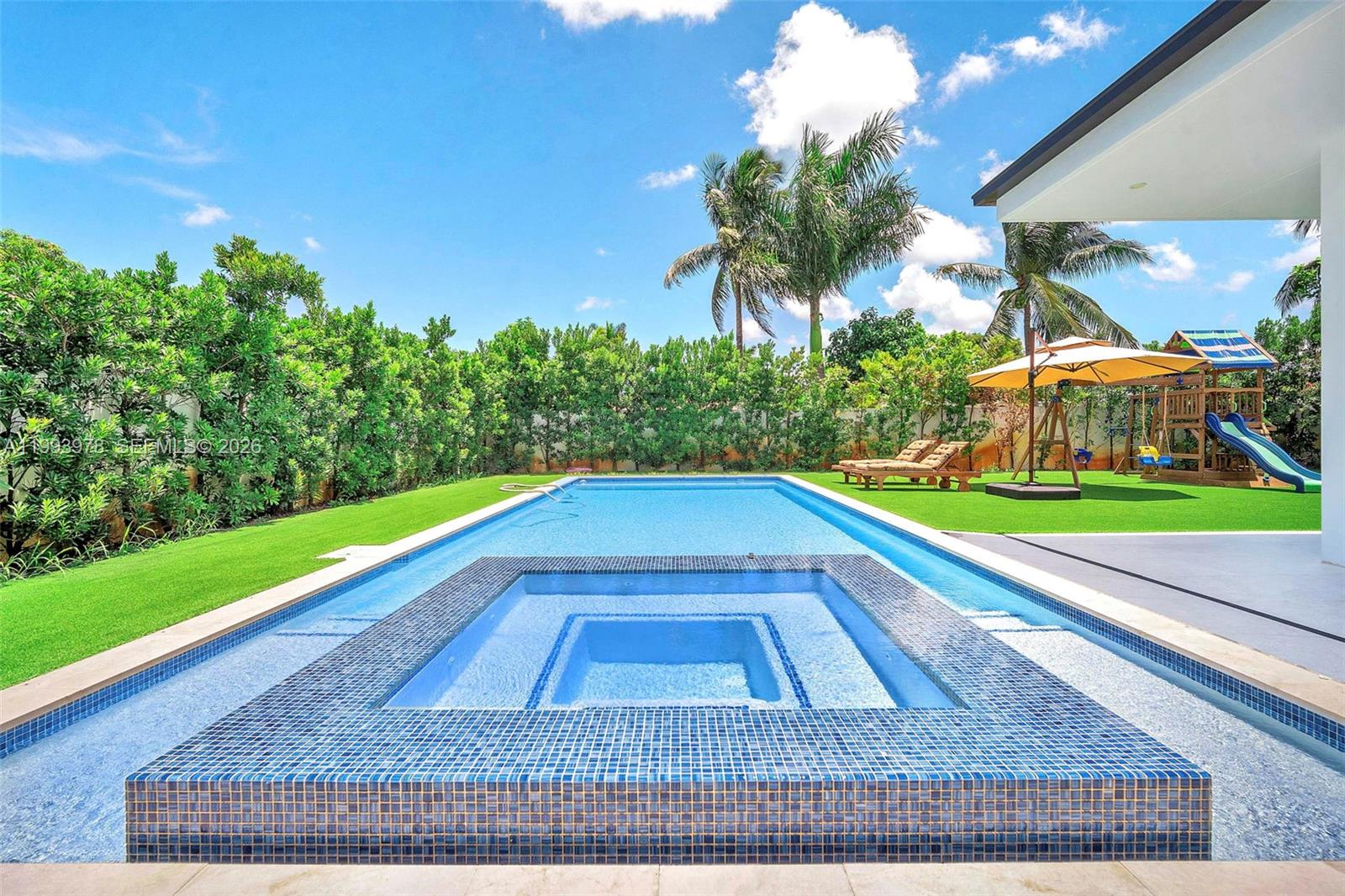 46 Northeast 162nd Street Miami, FL 33162 - Photo 5 of 44 a view of outdoor space with swimming pool