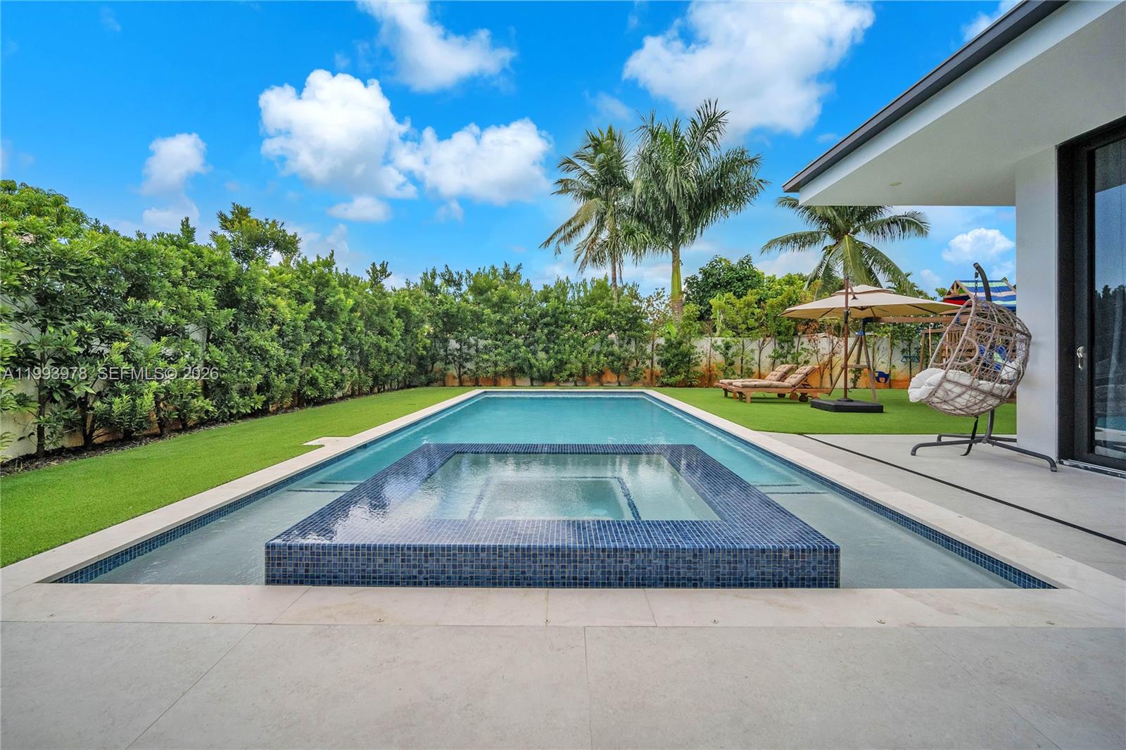 46 Northeast 162nd Street Miami, FL 33162 - Photo 6 of 44 a view of swimming pool with a yard