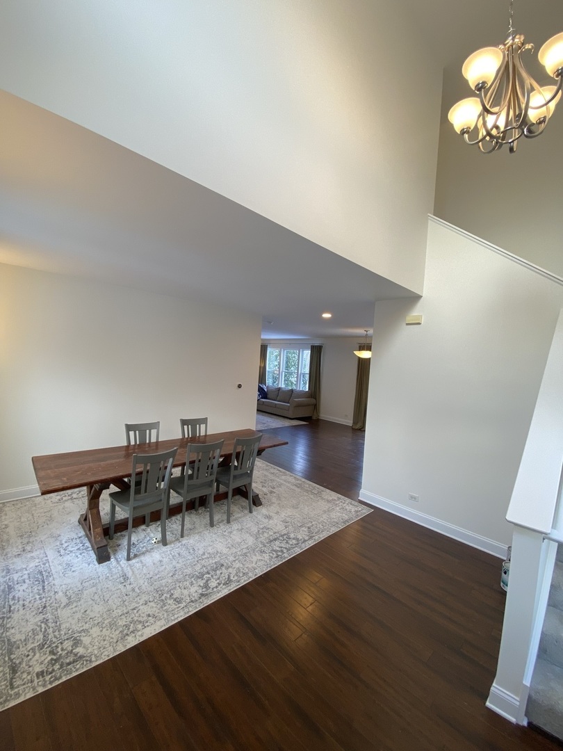 240 Copper Mountain Drive Gilberts, IL 60136 - Photo 21 of 30 a dining room with furniture and wooden floor