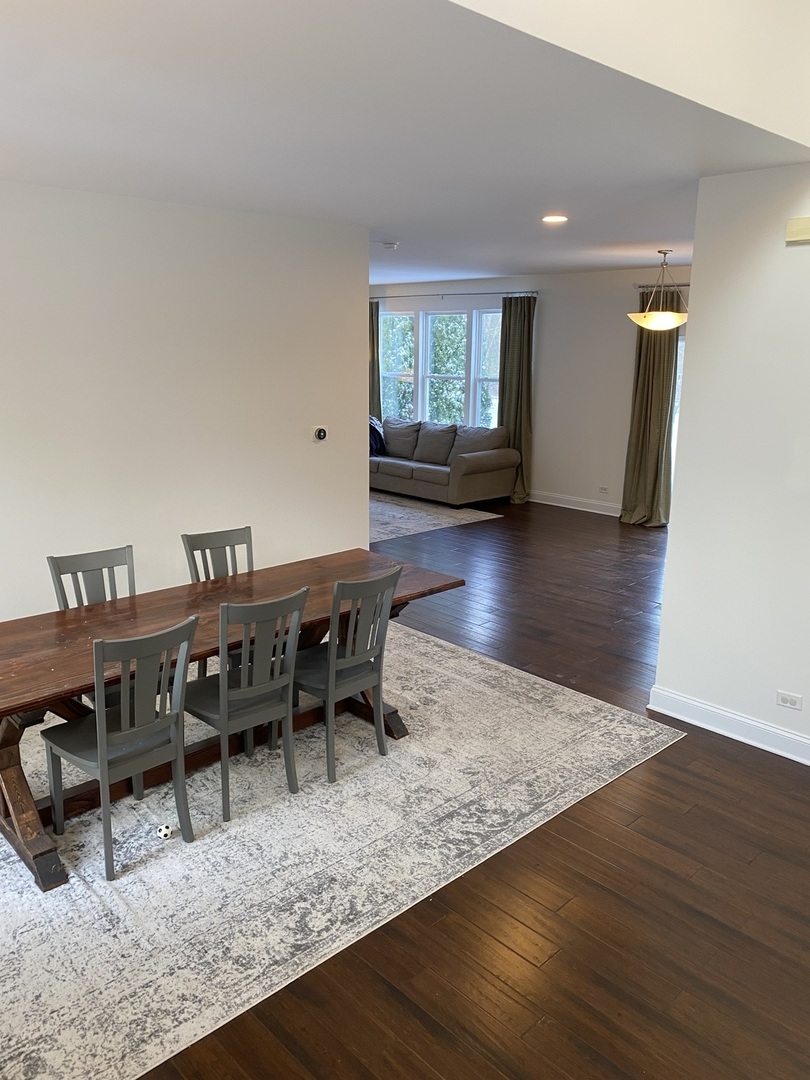 240 Copper Mountain Drive Gilberts, IL 60136 - Photo 22 of 30 a view of a dining room with furniture and wooden floor