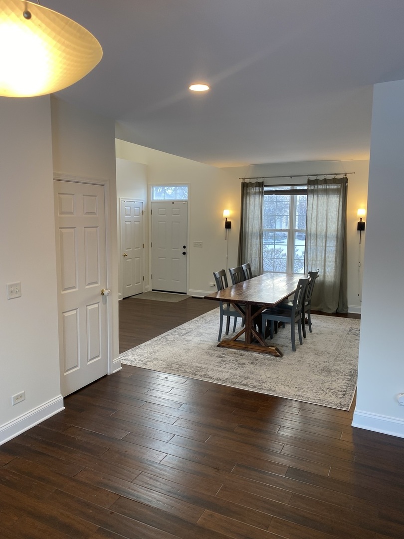 240 Copper Mountain Drive Gilberts, IL 60136 - Photo 23 of 30 a living room with furniture and a wooden floor