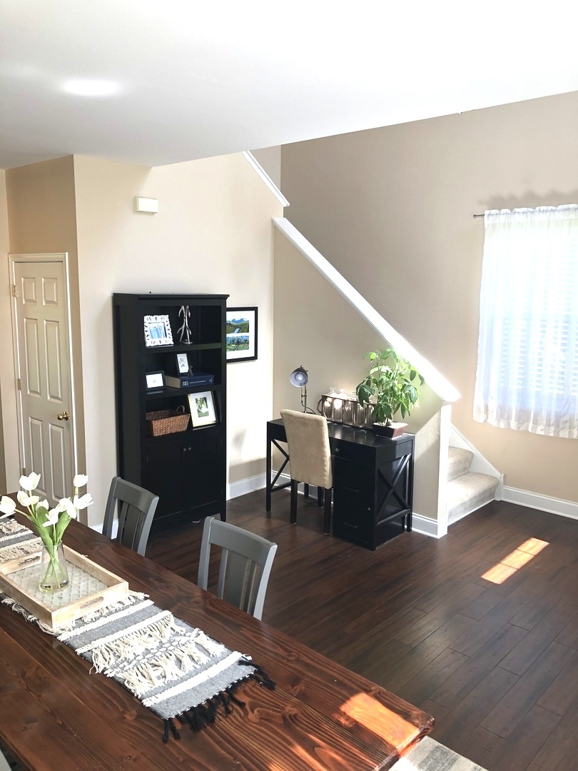 240 Copper Mountain Drive Gilberts, IL 60136 - Photo 4 of 30 a living room with furniture and a potted plant