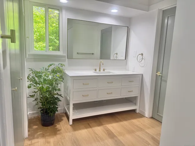 a bathroom with a sink and a mirror