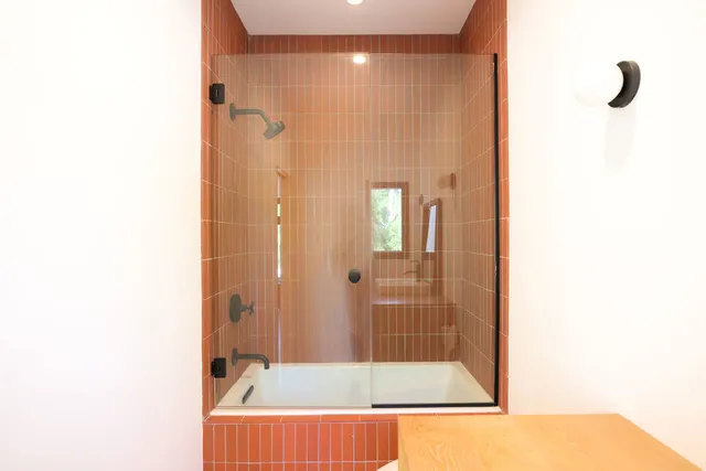 a picture of a bathroom with a window