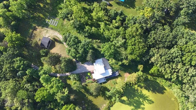 a backyard of a house with lots of green space
