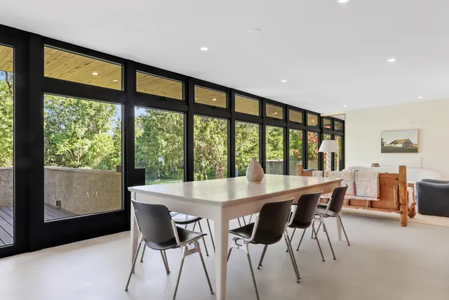 a view of a dining room with furniture window and outside view