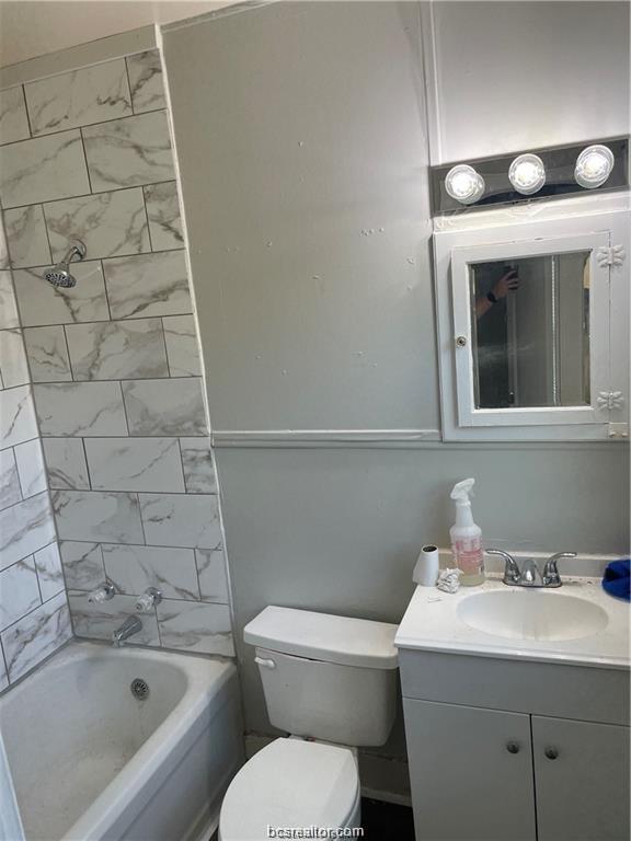 803 McAlpine Street Navasota, TX 77868 - Photo 3 of 7 a bathroom with a sink toilet and shower