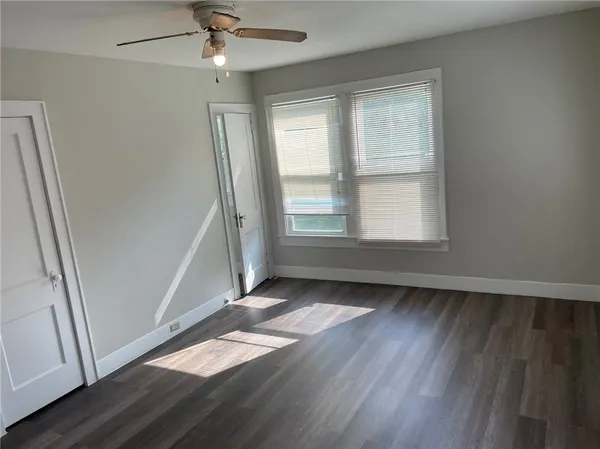 a kitchen with stainless steel appliances granite countertop a sink stove and wooden floor